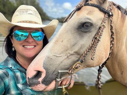 Carolyn Cox Nash Horse Trekking a woman posing for the camera with her horse